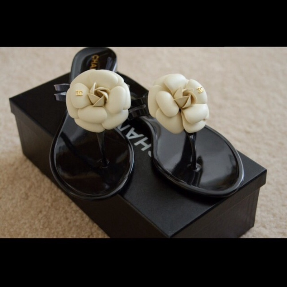 Chanel
Black Leather with Cream Camellia